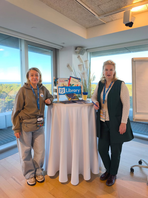 Shalom Bayit - Posing with PJ Library Books 
