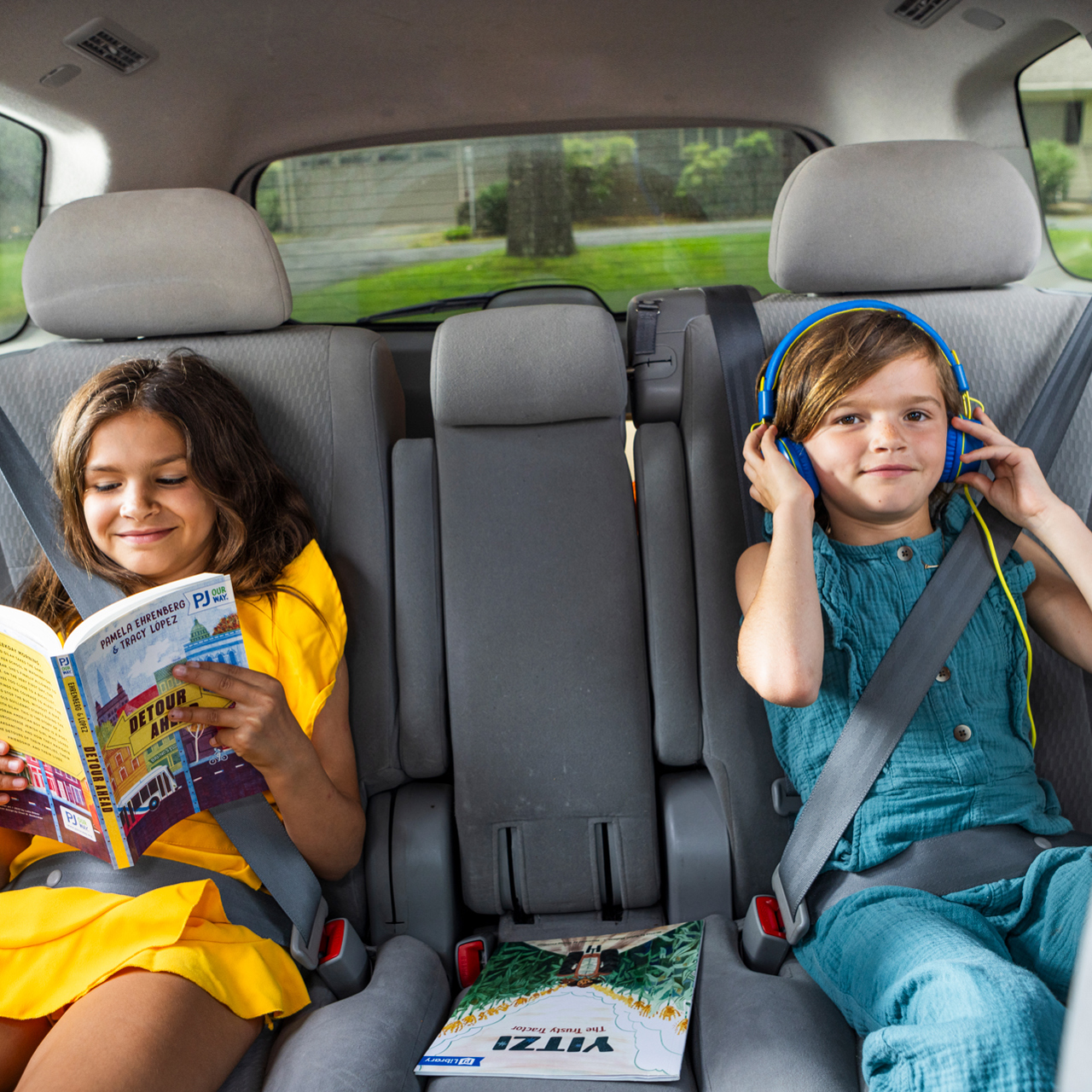 kids_enjoying_podcast_book_in_car.jpg