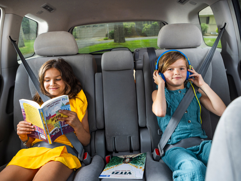 kids_enjoying_podcast_book_in_car.jpg
