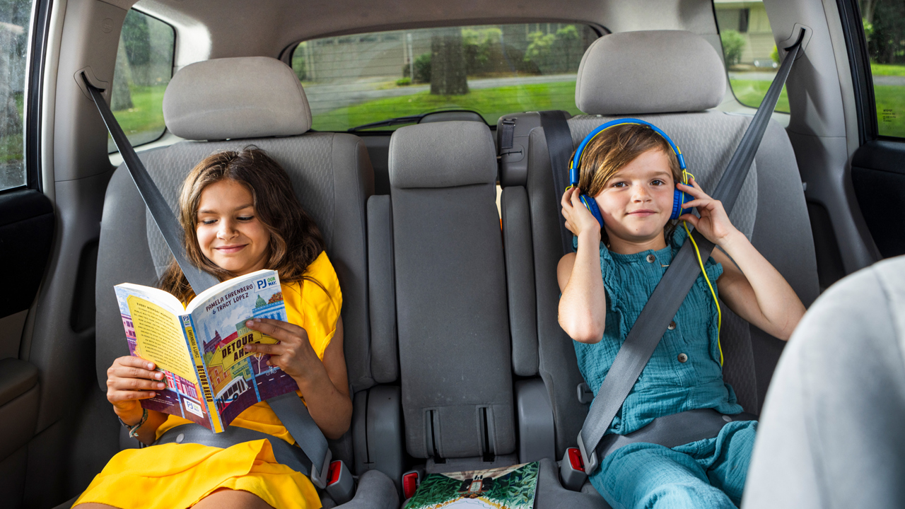 kids_enjoying_podcast_book_in_car.jpg