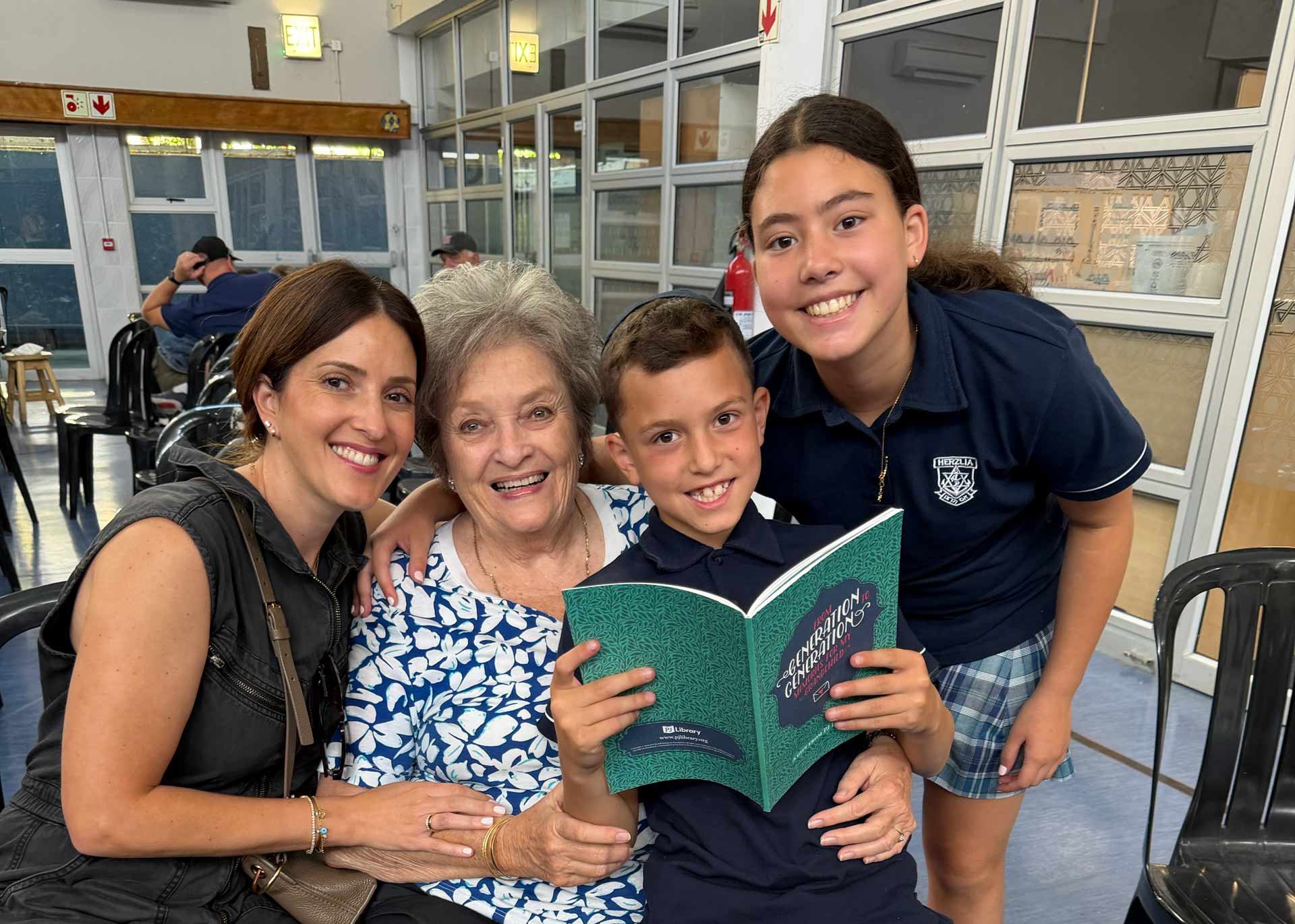 family_smiles_with_book.jpg